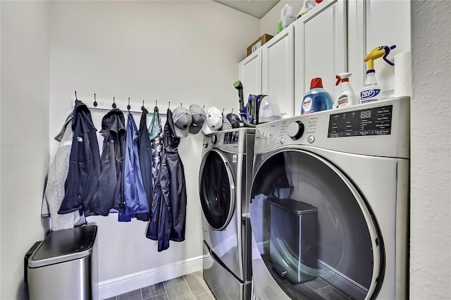 1669 Feather Grass Loop, Lutz, FL 33558 - laundry room with washing machine and dryer, cabinet space, and wood finished floors