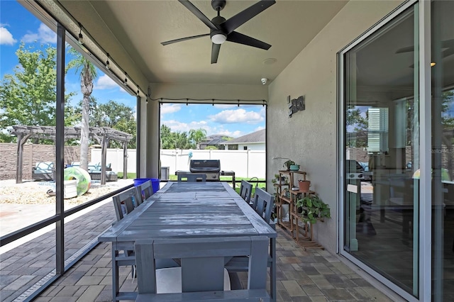 1669 Feather Grass Loop, Lutz, FL 33558 - sunroom with ceiling fan, healthy amount of natural light, and outdoor dining area