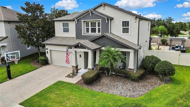 1669 Feather Grass Loop, Lutz, FL 33558 - view of front facade featuring an attached garage, decorative driveway, and stucco siding