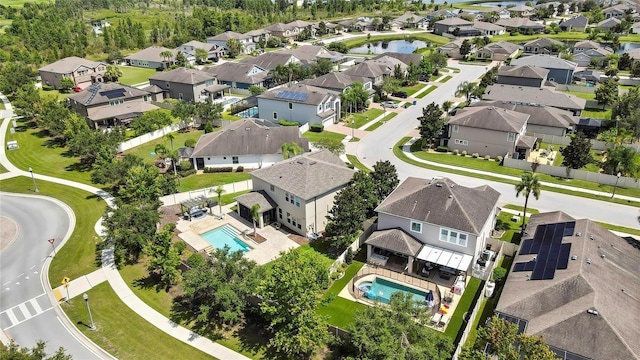 1669 Feather Grass Loop, Lutz, FL 33558 - aerial view of residential area featuring a pool area and a nearby body of water