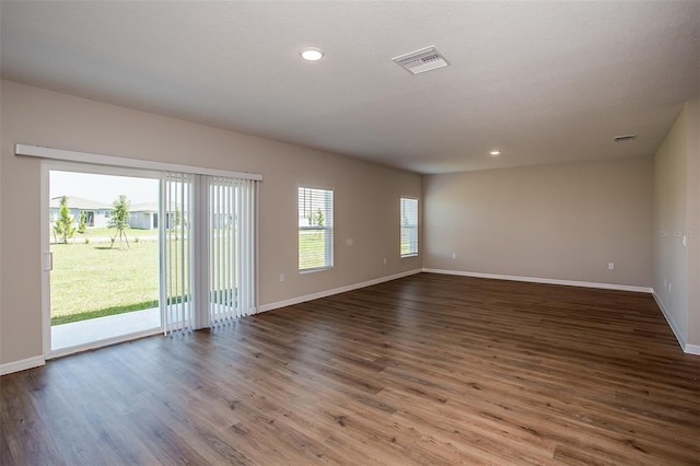 1229 Tidal St, Haines City, FL 33844 - unfurnished room featuring wood finished floors and recessed lighting