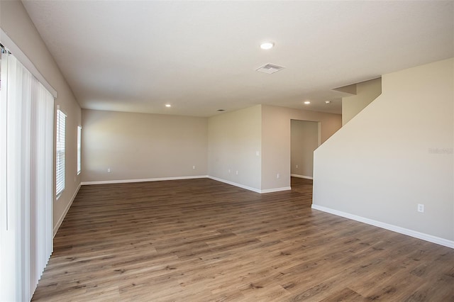 1229 Tidal St, Haines City, FL 33844 - unfurnished room featuring wood finished floors and recessed lighting