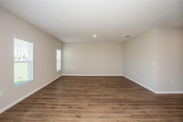 1229 Tidal St, Haines City, FL 33844 - empty room featuring wood finished floors and recessed lighting