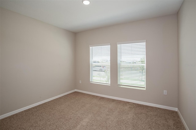 1229 Tidal St, Haines City, FL 33844 - carpeted spare room featuring baseboards