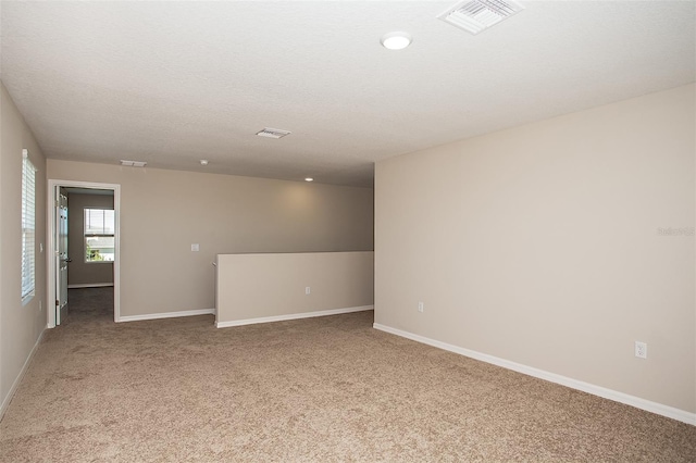 1229 Tidal St, Haines City, FL 33844 - spare room with light carpet and baseboards