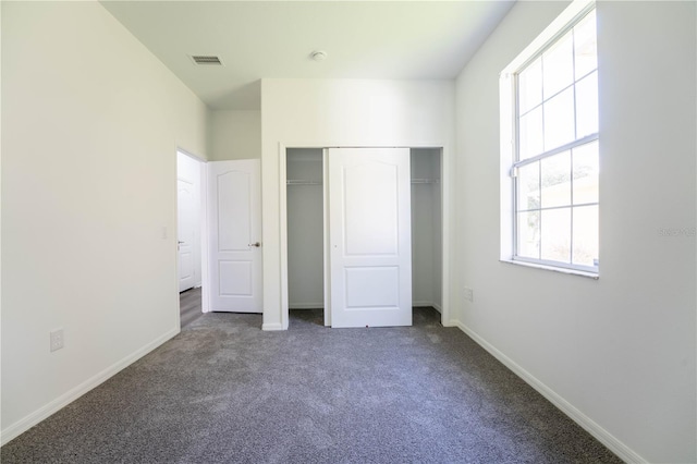9110 Lantern Oak Way, Land O Lakes, FL 34638 - unfurnished bedroom with carpet and a closet