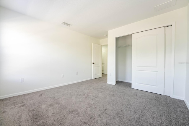 9110 Lantern Oak Way, Land O Lakes, FL 34638 - unfurnished bedroom featuring carpet and a closet