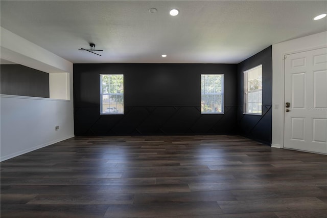 9110 Lantern Oak Way, Land O Lakes, FL 34638 - empty room featuring dark wood-style floors and recessed lighting