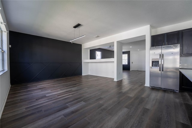 9110 Lantern Oak Way, Land O Lakes, FL 34638 - kitchen with stainless steel refrigerator with ice dispenser, dark wood-style floors, light countertops, open floor plan, and dark cabinets