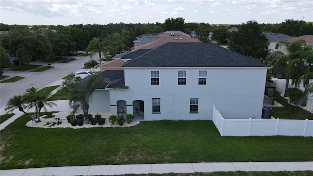 9110 Lantern Oak Way, Land O Lakes, FL 34638 - back of house with a shingled roof and stucco siding