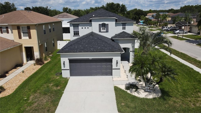 9110 Lantern Oak Way, Land O Lakes, FL 34638 - view of front of house with stucco siding, driveway, an attached garage, and a front yard