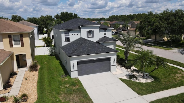 9110 Lantern Oak Way, Land O Lakes, FL 34638 - view of front of house featuring stucco siding, a shingled roof, a residential view, a garage, and driveway