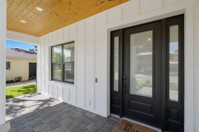 4114 W Neptune St, Tampa, FL 33629 - doorway to property with board and batten siding
