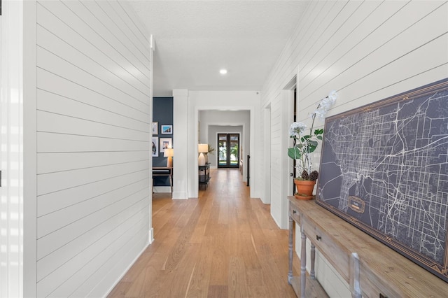 4114 W Neptune St, Tampa, FL 33629 - hall featuring light wood finished floors, wood walls, and recessed lighting