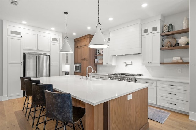 4114 W Neptune St, Tampa, FL 33629 - kitchen featuring open shelves, appliances with stainless steel finishes, recessed lighting, backsplash, and light countertops
