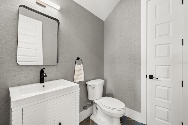 4114 W Neptune St, Tampa, FL 33629 - bathroom featuring vanity, tile patterned floors, and vaulted ceiling
