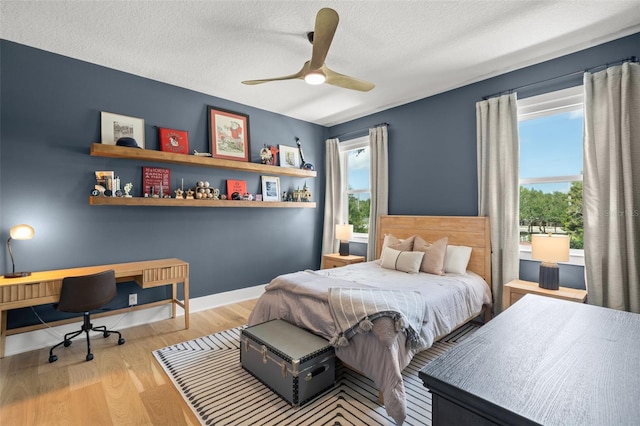 4114 W Neptune St, Tampa, FL 33629 - bedroom featuring wood finished floors, a desk, a textured ceiling, and ceiling fan