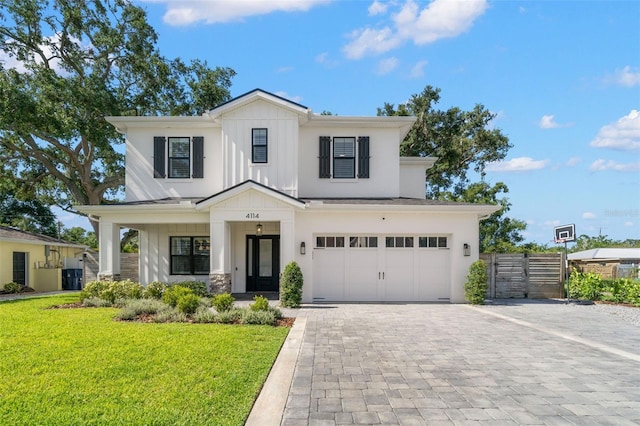 4114 W Neptune St, Tampa, FL 33629 - view of front of property featuring board and batten siding, decorative driveway, a garage, a porch, and stone siding