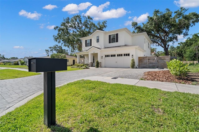 4114 W Neptune St, Tampa, FL 33629 - modern farmhouse style home with decorative driveway, a garage, stucco siding, and board and batten siding