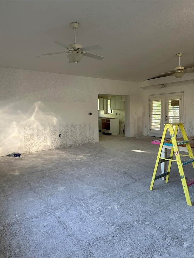 103 9th St, Belleair Beach, FL 33786 - unfurnished room with ceiling fan, light carpet, and french doors