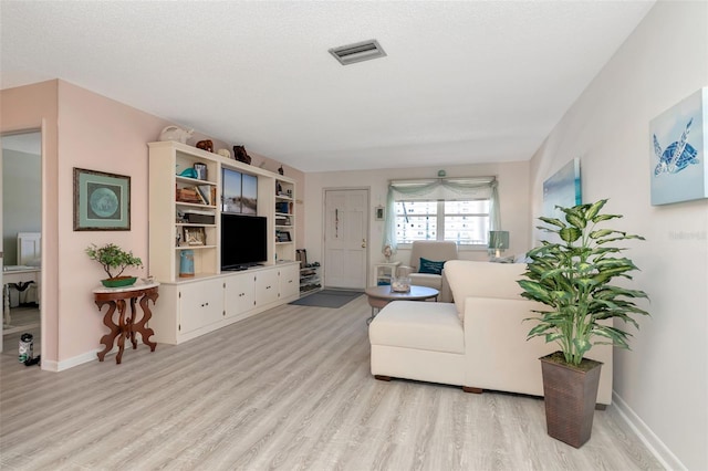 6025 Shore Blvd S Unit 408, Gulfport, FL 33707 - living area featuring light wood finished floors and ceiling fan