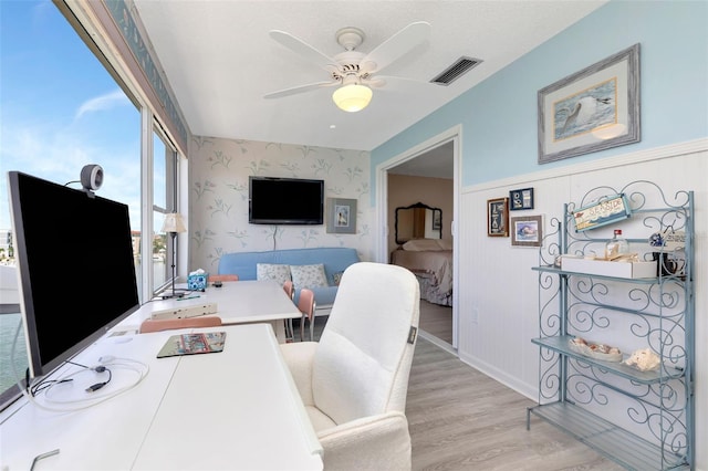6025 Shore Blvd S Unit 408, Gulfport, FL 33707 - office space with wallpapered walls, light wood-type flooring, ceiling fan, and a wainscoted wall