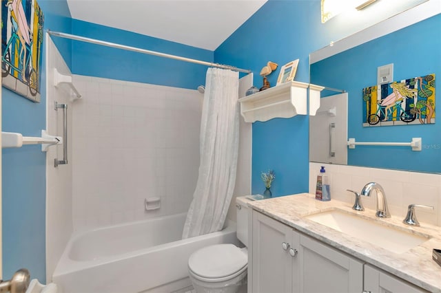 6025 Shore Blvd S Unit 408, Gulfport, FL 33707 - bathroom with vanity, shower / bath combo with shower curtain, and backsplash