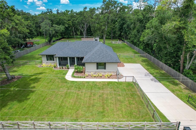 5080 Maple Dr, Lakeland, FL 33810 - ranch-style home with stucco siding, stone siding, and roof with shingles