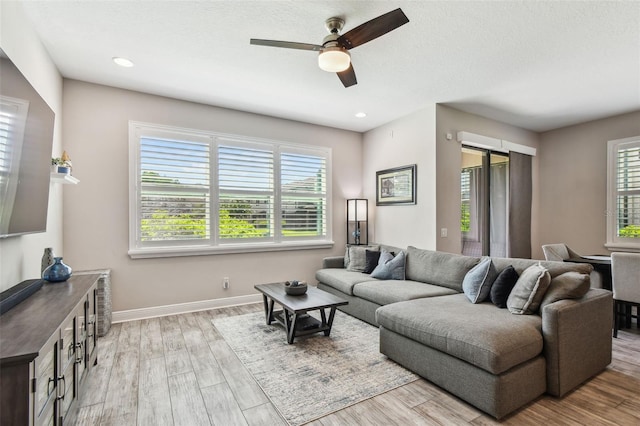 11519 Crowned Sparrow Ln, Tampa, FL 33626 - living room with ceiling fan, healthy amount of natural light, wood finished floors, and recessed lighting