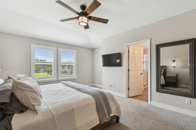 11519 Crowned Sparrow Ln, Tampa, FL 33626 - bedroom with carpet floors, ensuite bathroom, and a ceiling fan