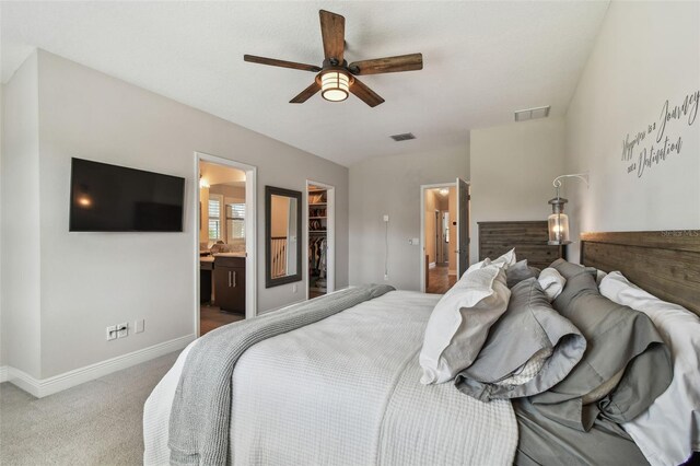 11519 Crowned Sparrow Ln, Tampa, FL 33626 - bedroom with a spacious closet, carpet flooring, ensuite bathroom, ceiling fan, and a closet