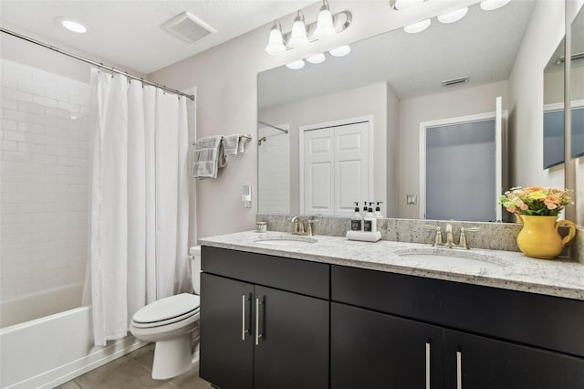 11519 Crowned Sparrow Ln, Tampa, FL 33626 - bathroom with double vanity, shower / tub combo, and tile patterned flooring