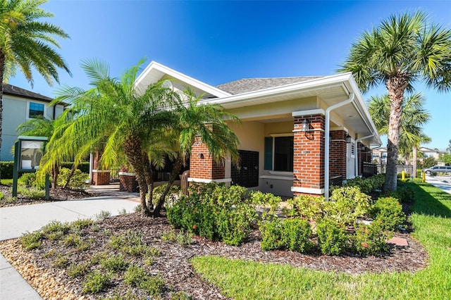 11519 Crowned Sparrow Ln, Tampa, FL 33626 - view of front facade with brick siding
