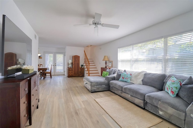 408 Georgia Ave, Crystal Beach, FL 34681 - living area featuring stairs, light wood finished floors, ceiling fan, and french doors