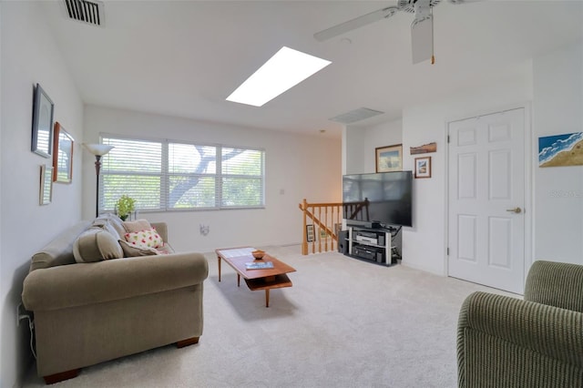 408 Georgia Ave, Crystal Beach, FL 34681 - living room with a skylight, ceiling fan, and light colored carpet