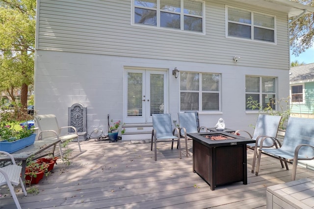 408 Georgia Ave, Crystal Beach, FL 34681 - wooden terrace with french doors and a fire pit
