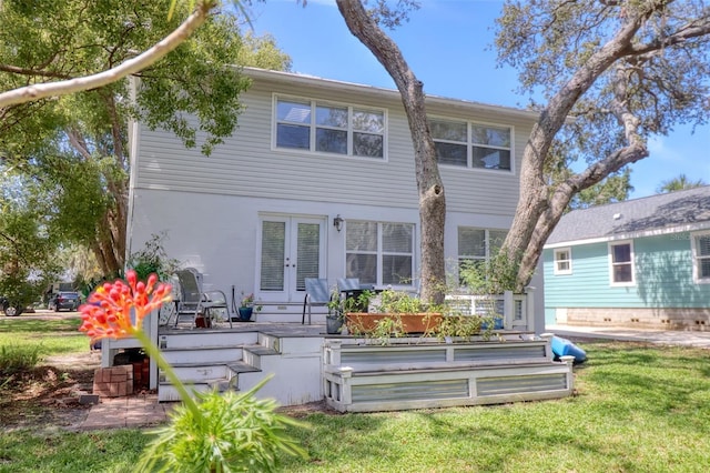 408 Georgia Ave, Crystal Beach, FL 34681 - back of house with french doors, a yard, and a deck