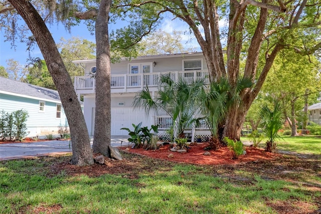 408 Georgia Ave, Crystal Beach, FL 34681 - view of front of home with a garage, covered porch, and driveway