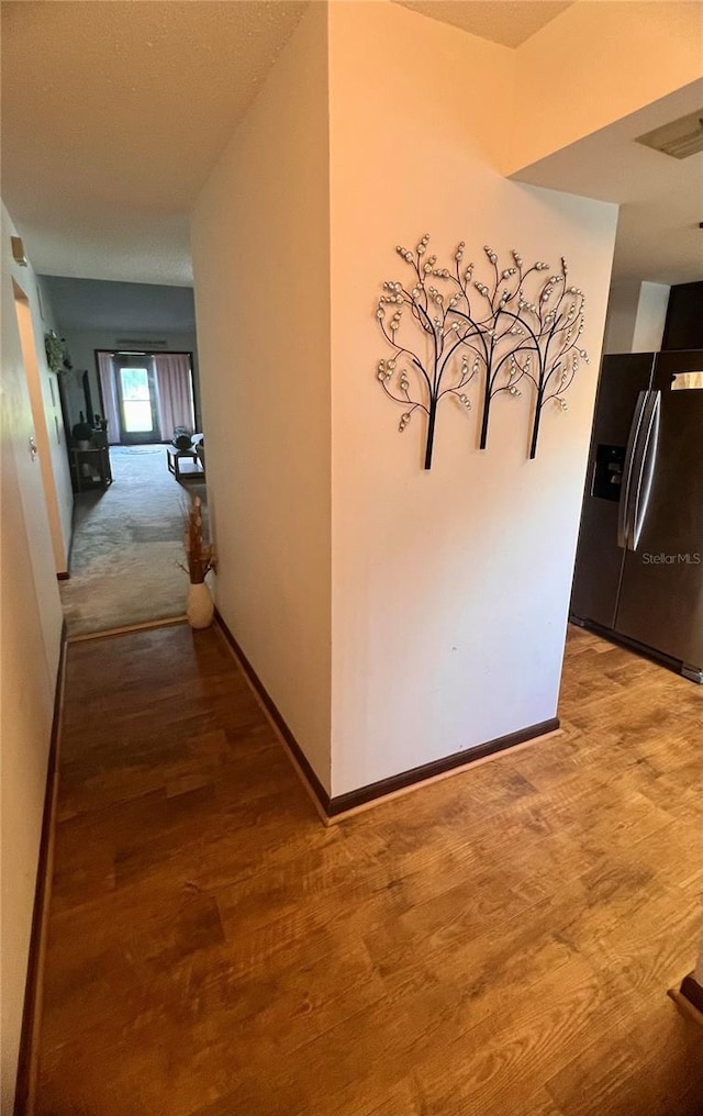 35140 Whispering Oaks Blvd, Dade City, FL 33523 - hallway featuring light wood-style floors