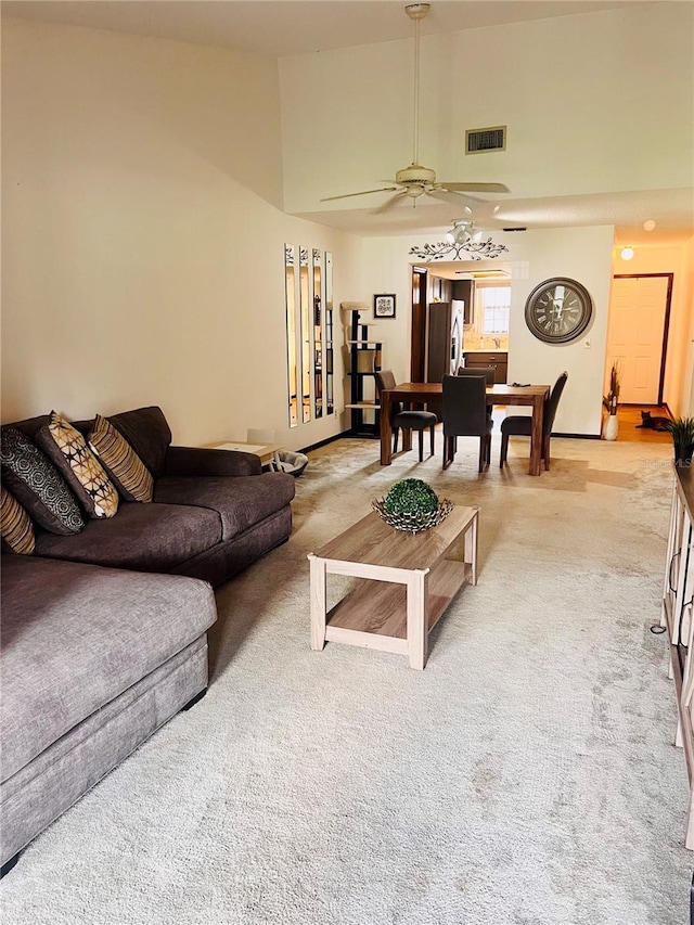 35140 Whispering Oaks Blvd, Dade City, FL 33523 - living room with carpet flooring, ceiling fan, and high vaulted ceiling