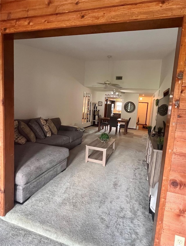 35140 Whispering Oaks Blvd, Dade City, FL 33523 - living room featuring carpet floors, a ceiling fan, and beam ceiling