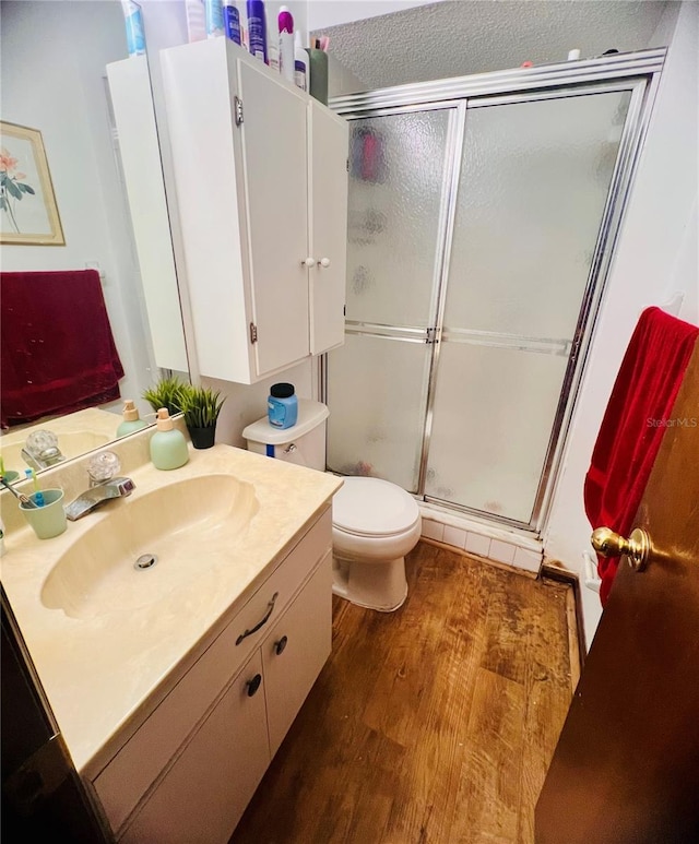 35140 Whispering Oaks Blvd, Dade City, FL 33523 - bathroom featuring vanity, a stall shower, and wood finished floors