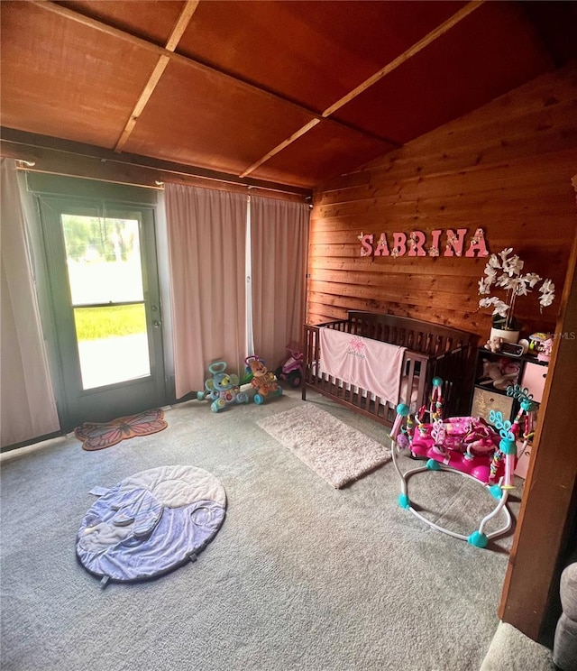 35140 Whispering Oaks Blvd, Dade City, FL 33523 - unfurnished bedroom with wooden walls, carpet, and lofted ceiling