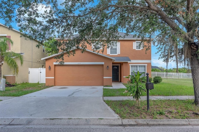 10523 Boyette Creek Blvd, Riverview, FL 33569 - view of front facade with stucco siding, concrete driveway, and an attached garage