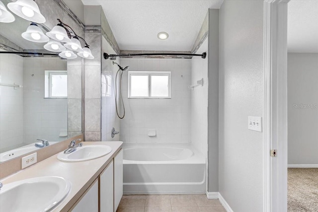 9907 Carlsdale Dr, Riverview, FL 33578 - bathroom featuring shower / bathtub combination, double vanity, a textured ceiling, and tile patterned flooring
