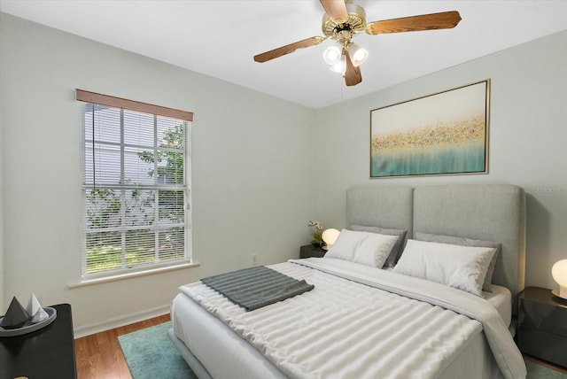 1741 Elk Spring Dr, Brandon, FL 33511 - bedroom with multiple windows, wood finished floors, and ceiling fan