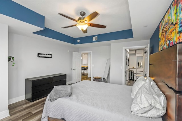 1108 N Franklin St Unit 602, Tampa, FL 33602 - bedroom featuring a raised ceiling, wood finished floors, and ceiling fan