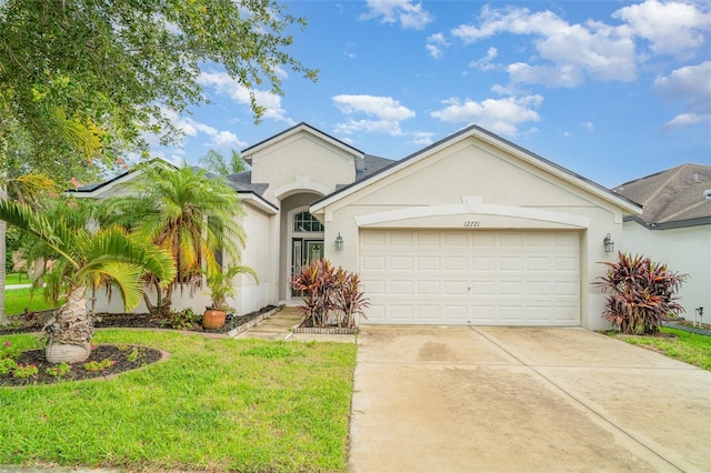 12721 Avelar Creek Dr, Riverview, FL 33578 - view of front of home with stucco siding, an attached garage, concrete driveway, a front lawn, and a shingled roof