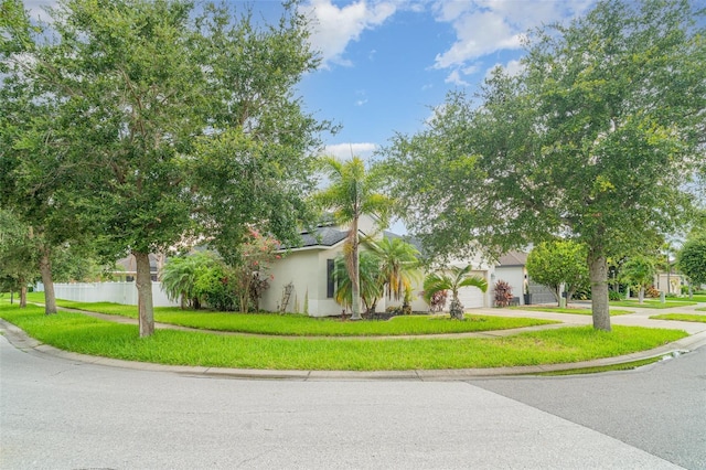 12721 Avelar Creek Dr, Riverview, FL 33578 - view of front facade featuring concrete driveway, an attached garage, and stucco siding