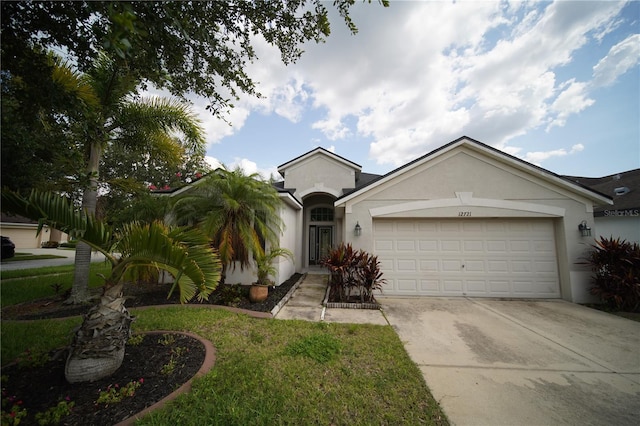 12721 Avelar Creek Dr, Riverview, FL 33578 - ranch-style house featuring stucco siding, concrete driveway, an attached garage, and a front lawn
